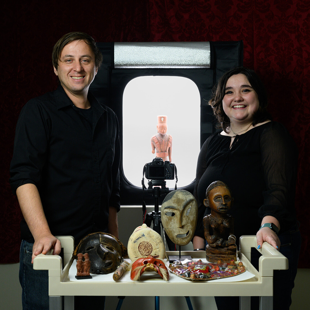 Anthropology Prof. Andrew Gurstelle and URECA Scholar Annelise Witcher (’26) pose for portraits at the LAM Museum and work on reach together about “Efficacy of Photogrammetry Practices for Archival Research and Replication of Artifacts”. Annelise is experimenting with 10 artifacts that pertain to illness or disability across cultures.