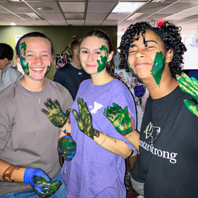 Students covered in paint