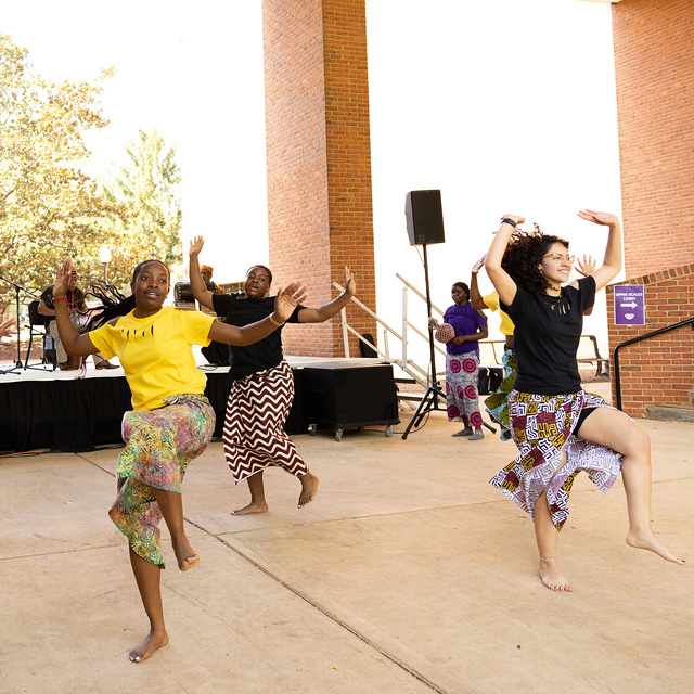 Dancers perform outside Scales Fine Arts Center