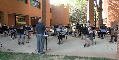 WFU wind ensemble performing in the scales breezeway