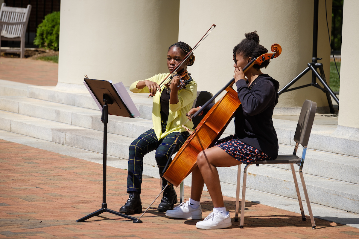 Students Zhane Waye and Morgan Lyke perform outside Wait Chapel