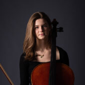 Sarah Bo seated with cello