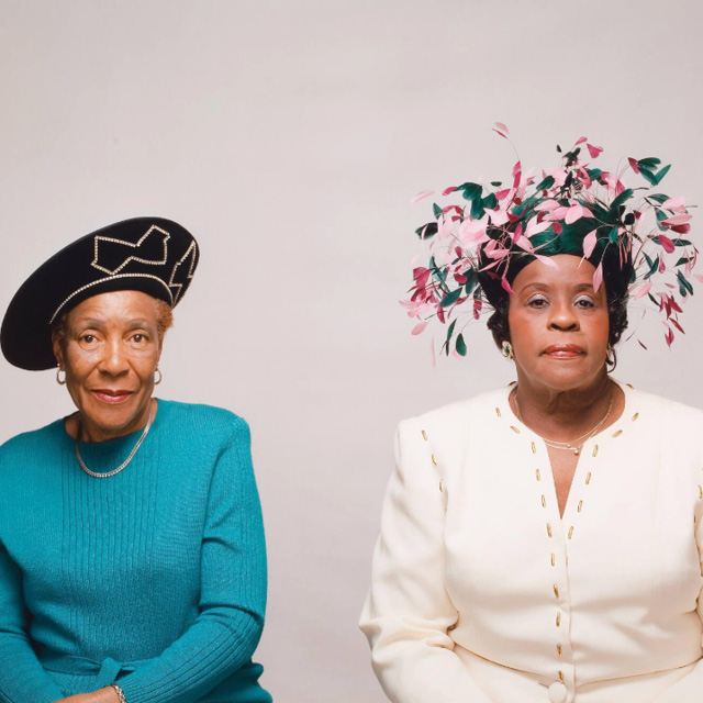 two women wearing hats