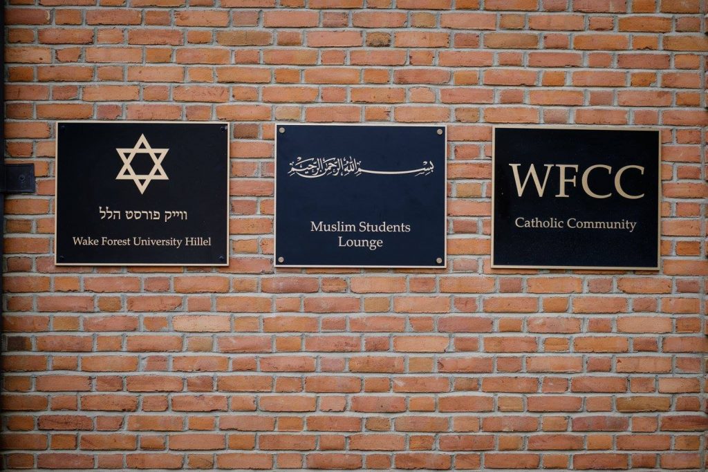Image of Religious Lounge Seals on Collins Hall for Jewish Life, Muslim Life, and Catholic Life.