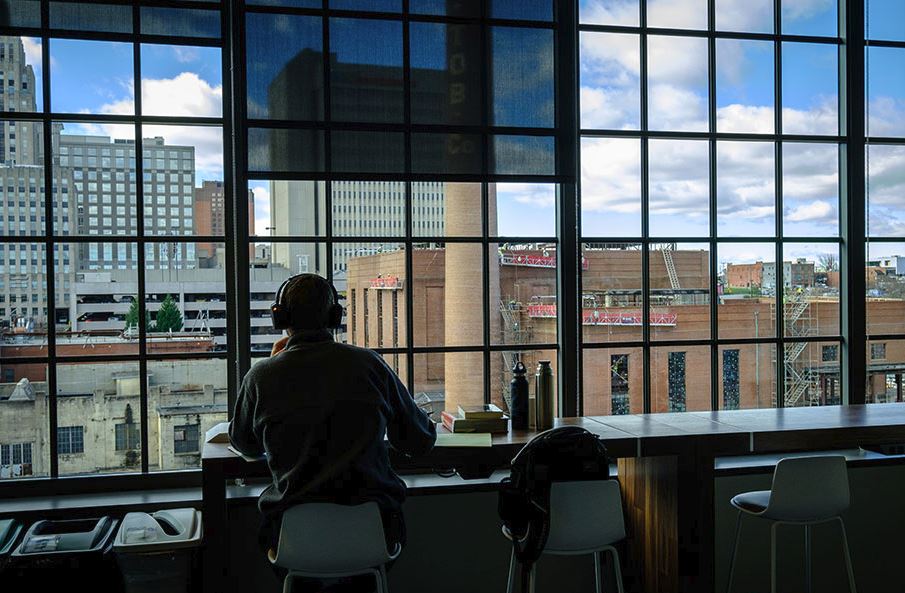student studying in the break area of the fourth floor