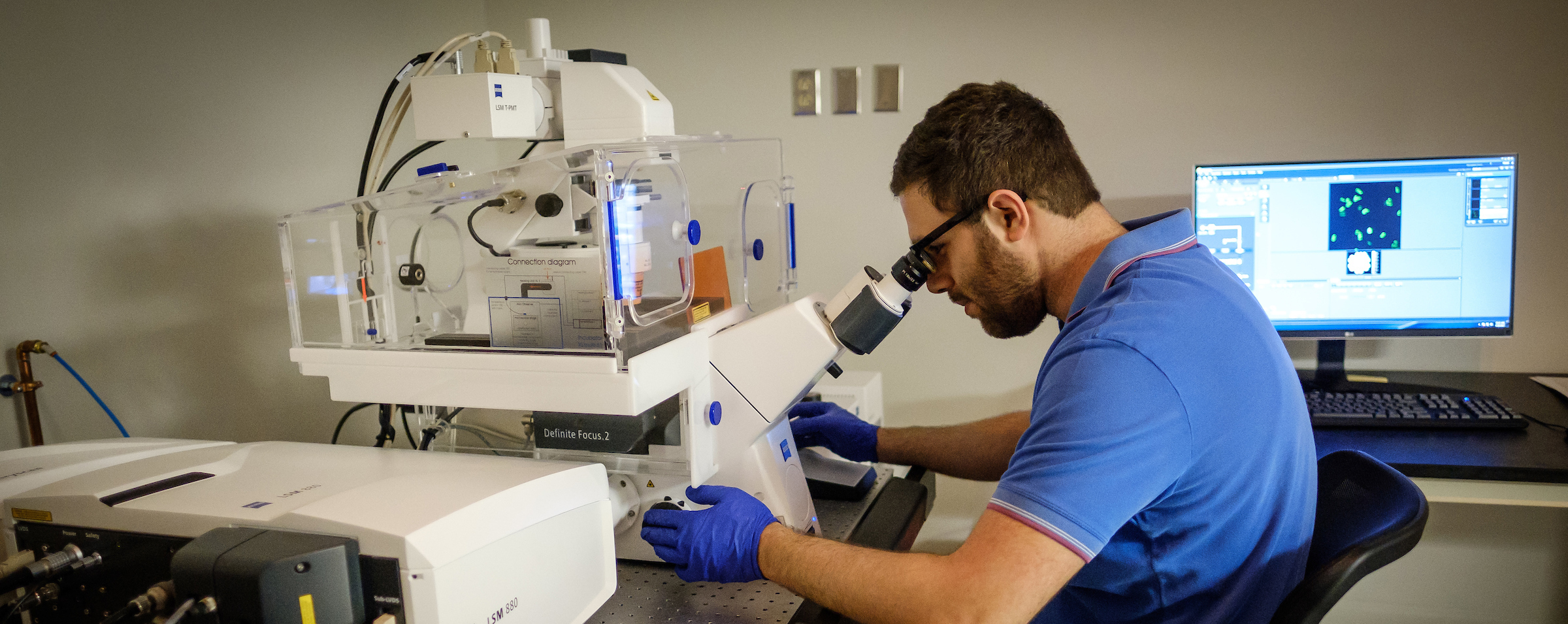 Fadi Marayati works in a microscope lab