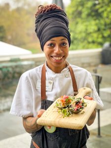 Chef TJ Wise sharing a culinary creation from Harvest Table.