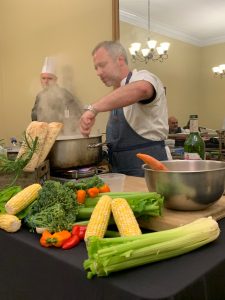 Chef William Dissen cooking during his  sustainability demonstration at Wake Forest. 