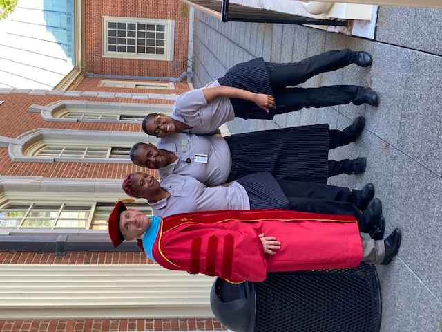 Dining team members pose for a photo with the WFU Registrar, Ken J. Gilson.