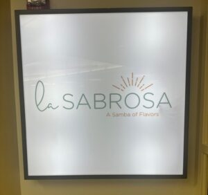 Photo of the new La Sabrosa sign, located in the retail dining area in the Benson Center. 