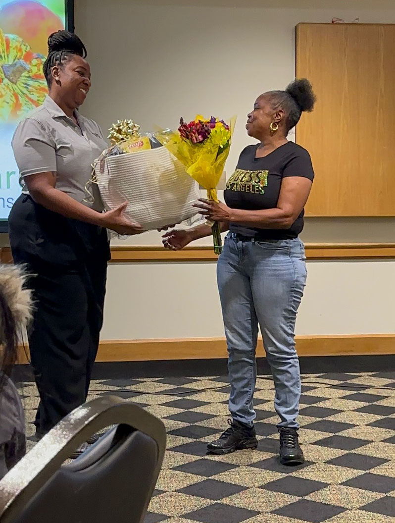 Photo of Wanda Samuels accepting her award for exemplary service.
