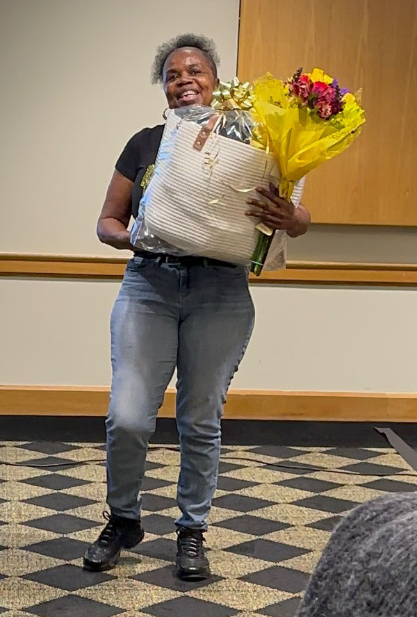 Photo of Wanda Samuels accepting her award for exemplary service. 