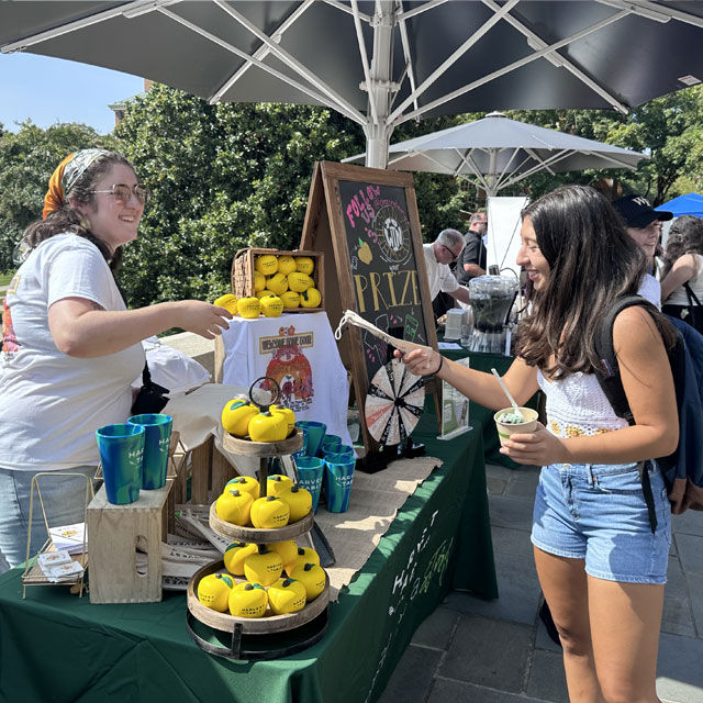 Harvest Table Culinary Group team members chat with students at the Welcome Home Event 2024.