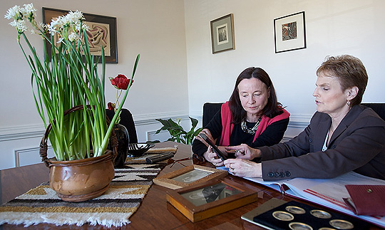 Examining letters at a table