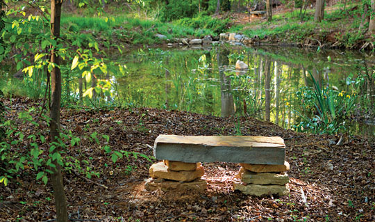 stone bench by a pond