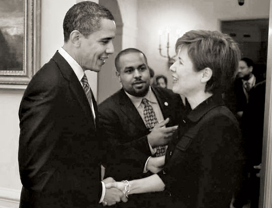 Melissa Rogers shakes President Obama's hand.