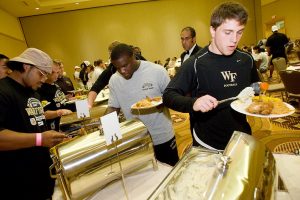 Players put food on their plates