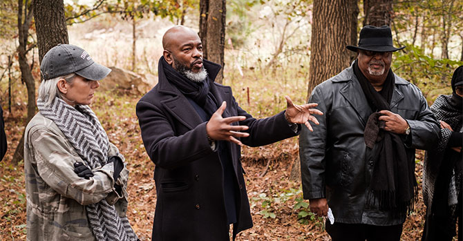 Derek Hicks speaking at the Original Campus cemetery