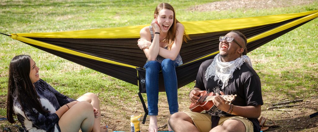 Students enjoying a sunny day on Davis Field