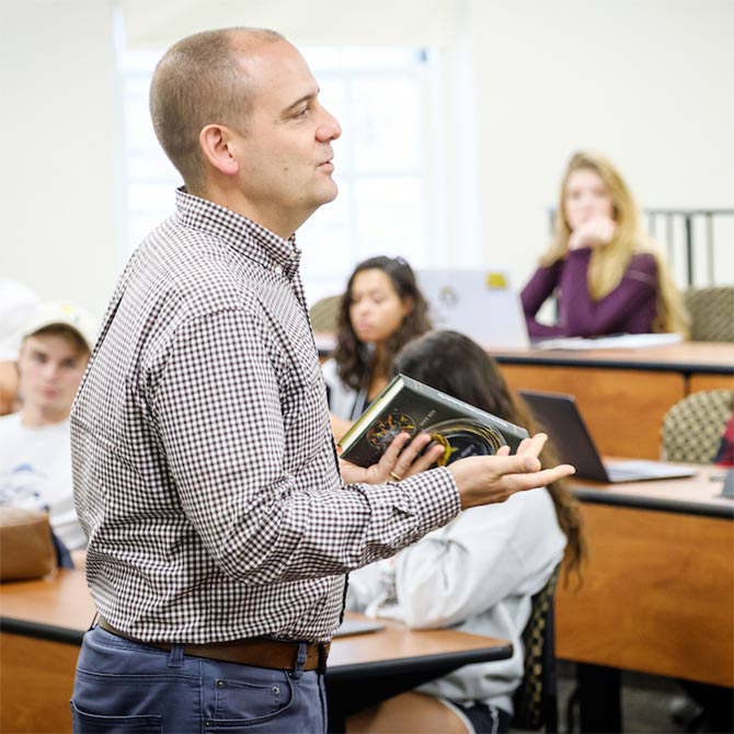 Wake Forest students in the First Year Experience class have a wide ranging discussion of the liberal arts, AP class credit, divisional requirements, and required language classes