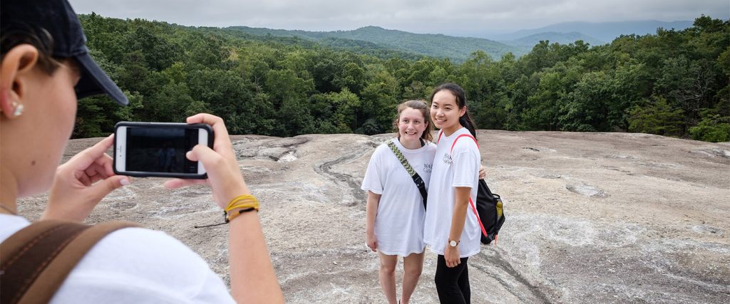 Wake Forest first year students in the WakeWell pre-orientation program hike the strenuous loop trail at Stone Mountain State Park.