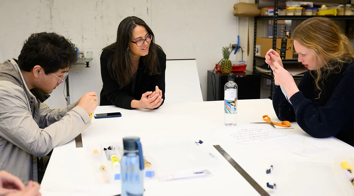 Professor working with students in class