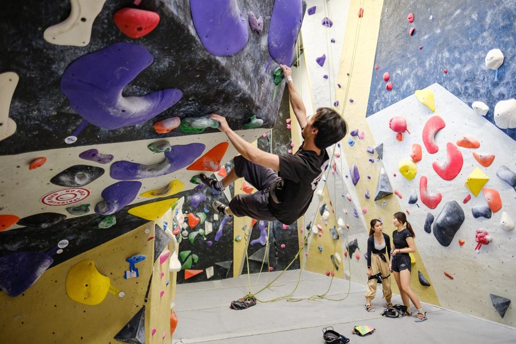 Wake Forest students climb the wall at the Wellbeing Center