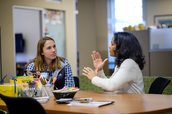 Career coach speaking with a student