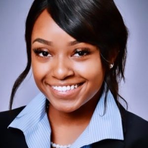 Professional headshot of Faith Chege