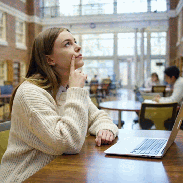 Female students sitting in ZSR library complete their career interests.