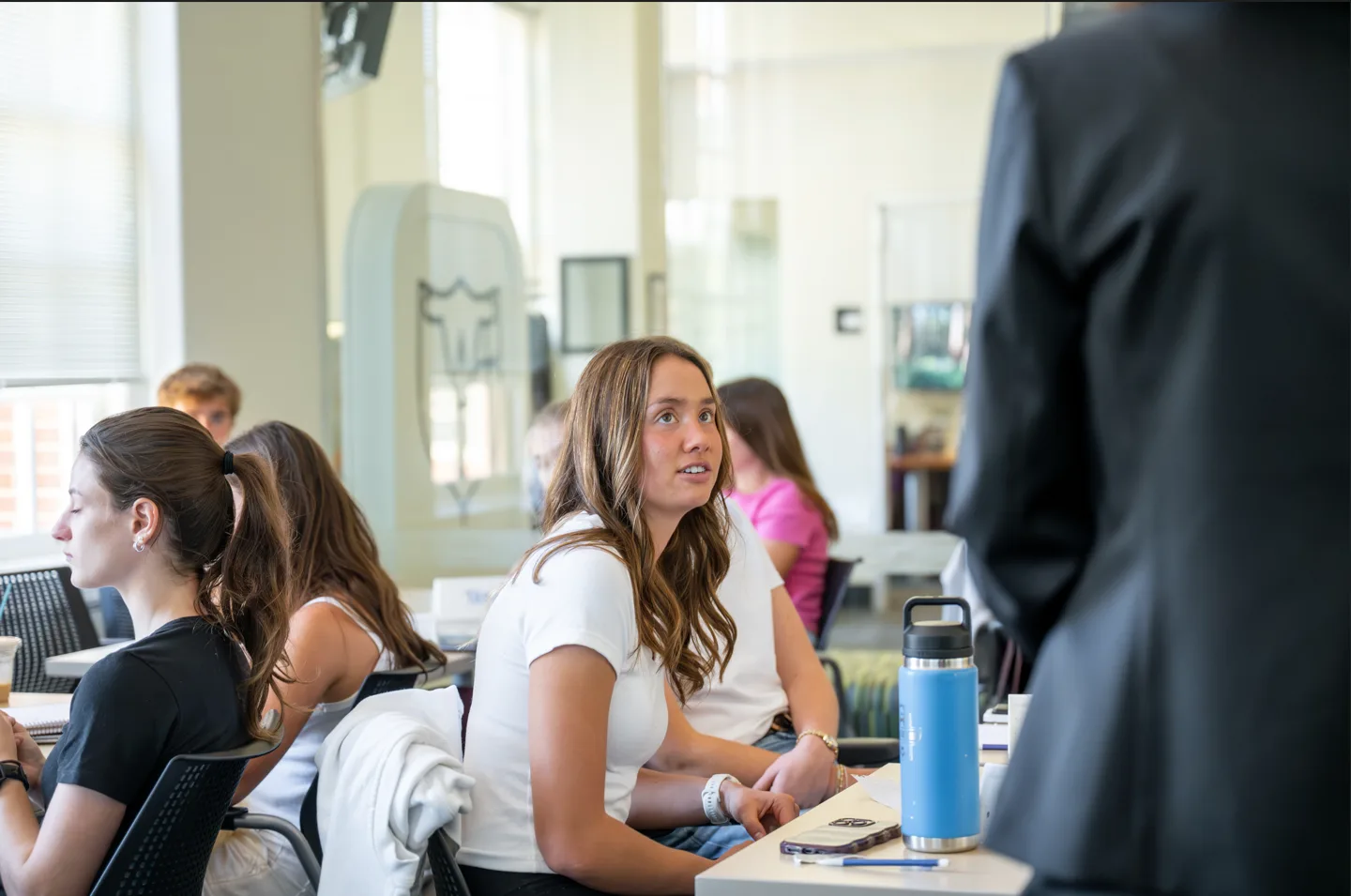 Student listens to Heidi Robinson during a College to Career course.