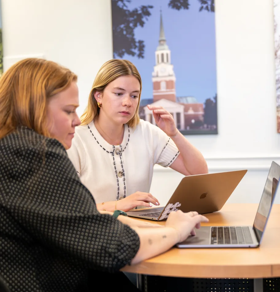 Kelsey Lane, a career coach, assists a student with her resume and cover letter.