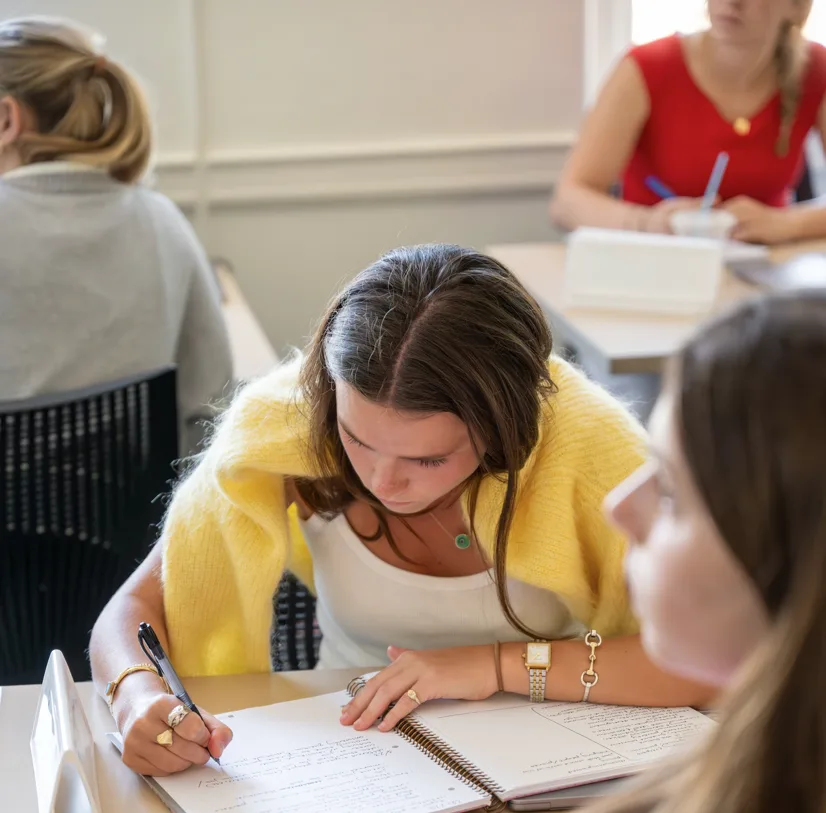 Student takes notes during one of our high demand College to Career courses.