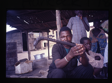 A man displaying the finished axe shape