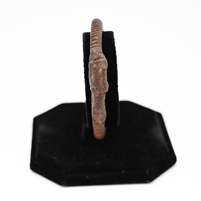 brass bracelet on a stand