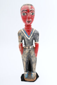 painted wood carving of a person