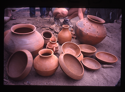 a group of unfinished pots