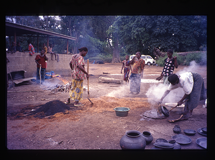 women firing pots