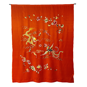 red silk sheet with embroidered animals