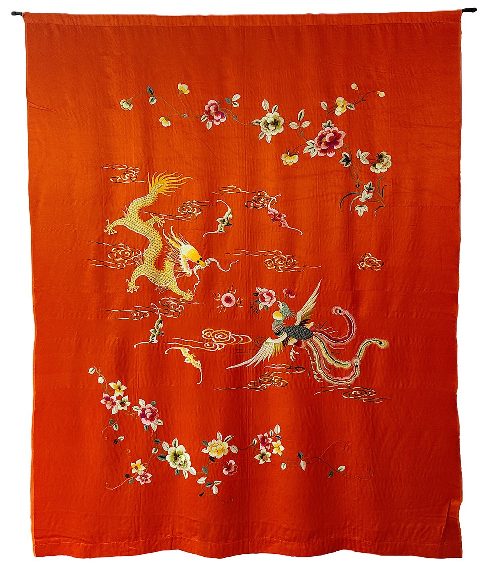 red silk sheet with embroidered animals