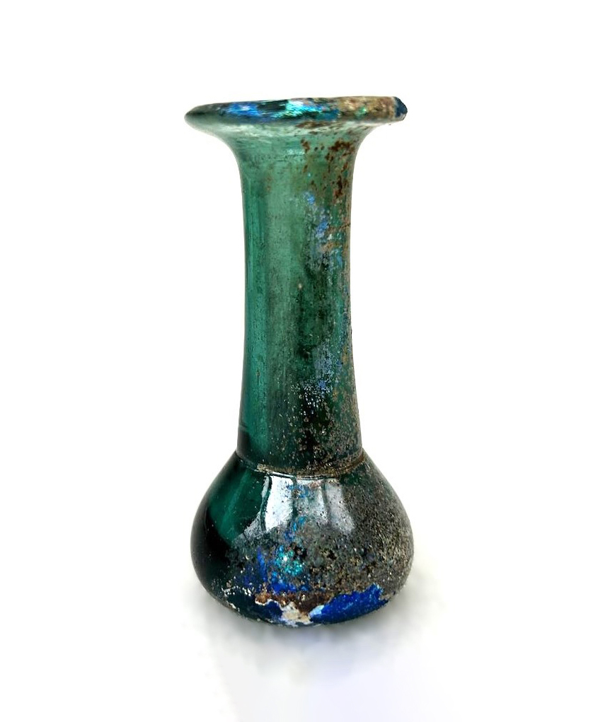 small green glass vial