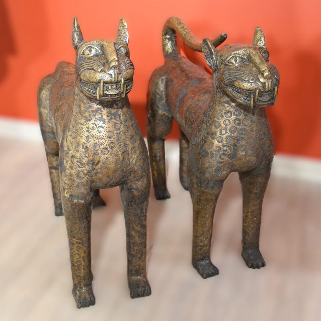 Two life-size brass leopards