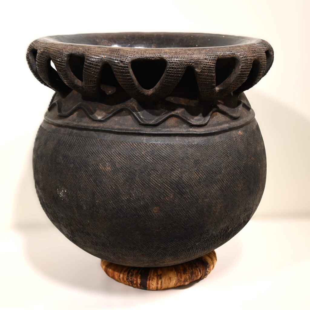 Large ceramic pot with X shaped detail on rim