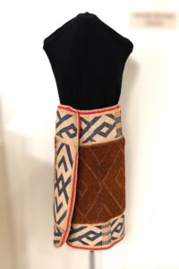 Mannequin wearing skirt with center panel and black and tan geometric border