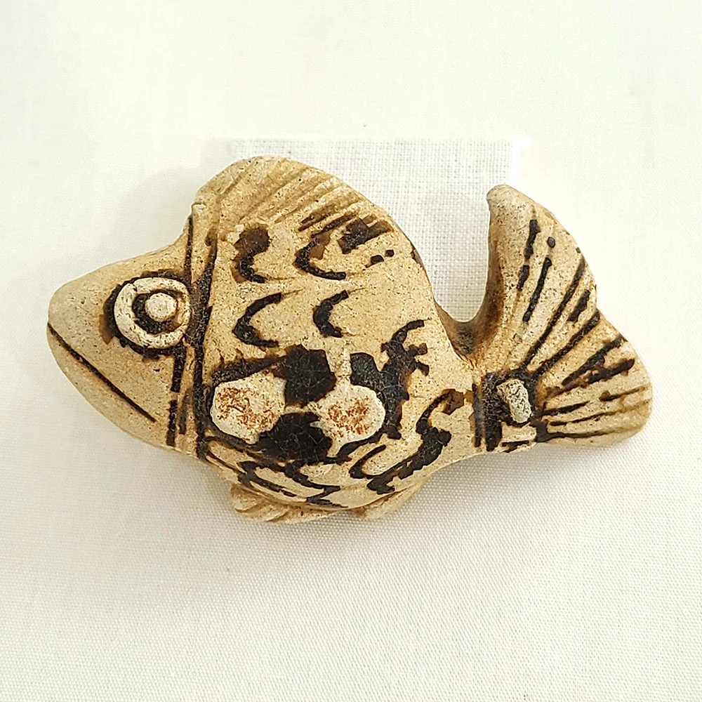 A small ceramic fish