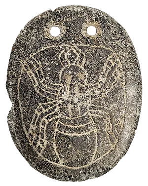 stone pendant with carving of a spider