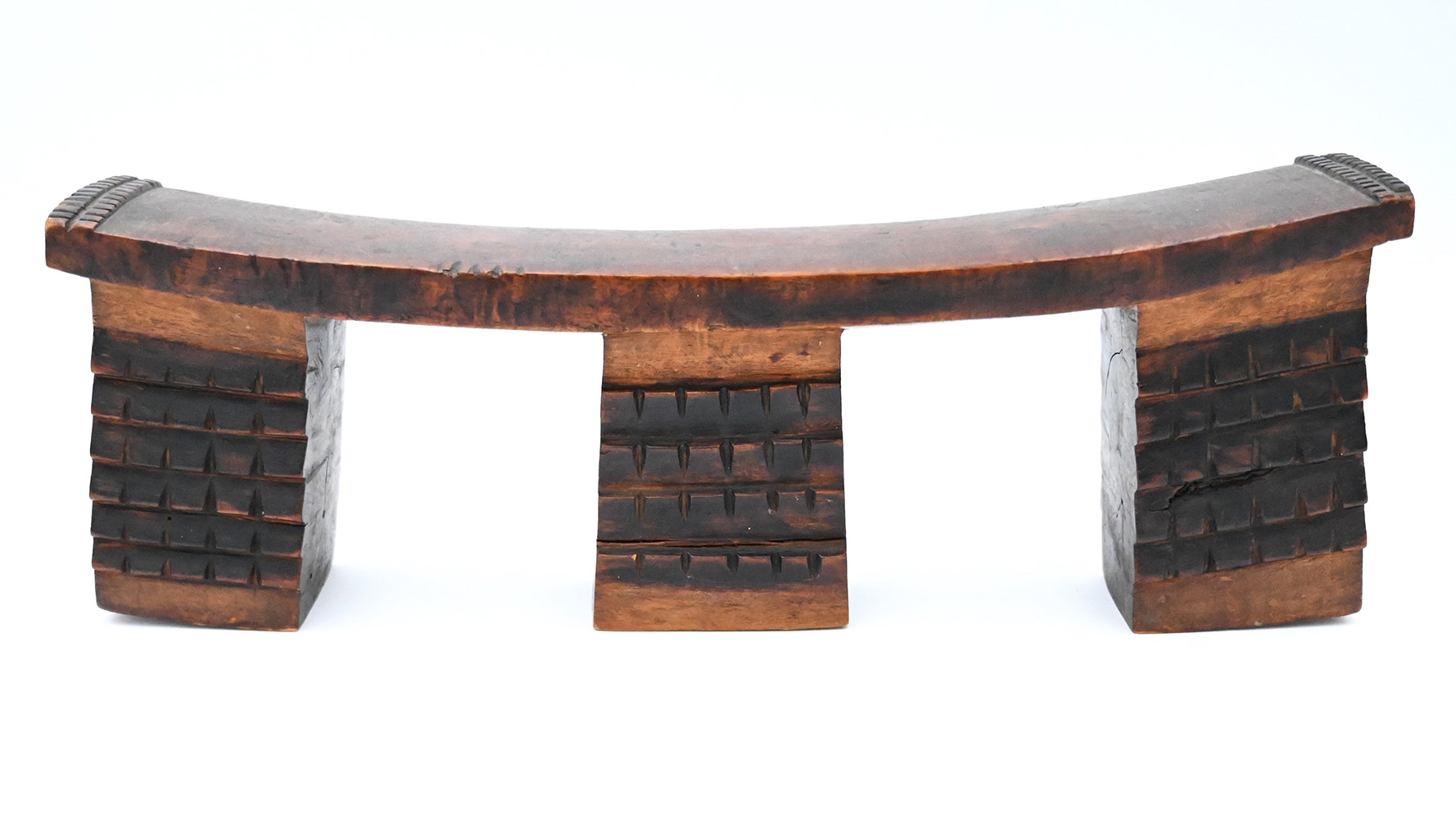 wide wooden headrest with three block-like supports