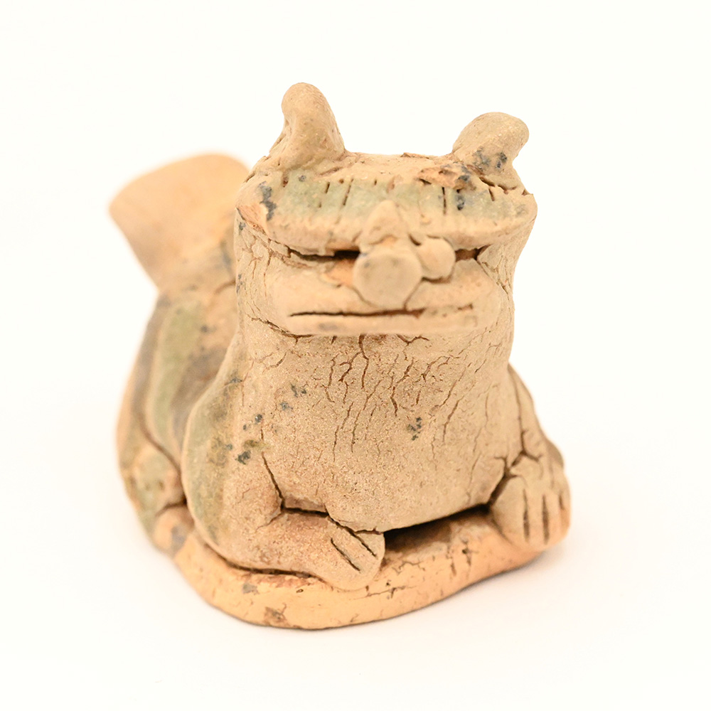miniature ceramic figure of a lion dog