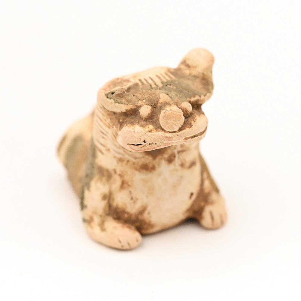 Miniature ceramic figure of a lion dog