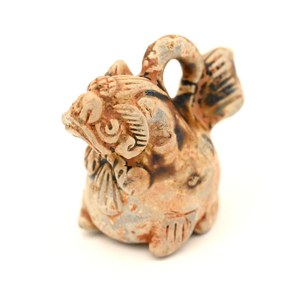 miniature ceramic figure of a lion dog